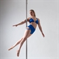 Discover Pole Dance Class - Woman in Blue Outfit on Pole